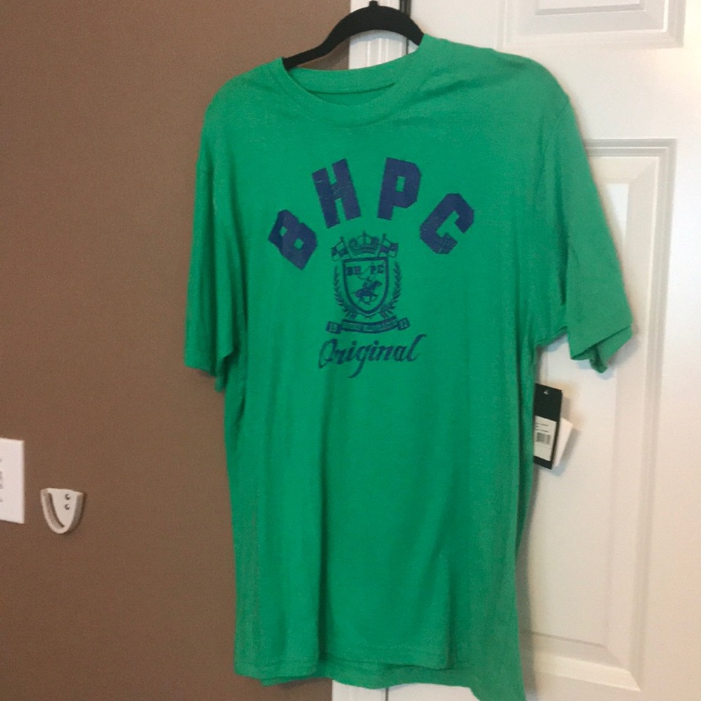 A green and navy blue polo shirt